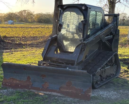 Caterpillar 259D skid steer with blade